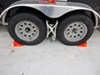 Ultra-Fab Chock and Lock wheel stabilizers behind trailer wheels. 
