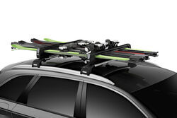 Thule SnowPack extender ski and snowboard carrier holding skis.
