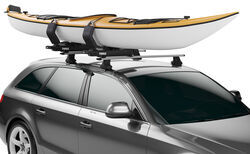 Thule Hullavator Pro kayak roof rack holding kayak.
