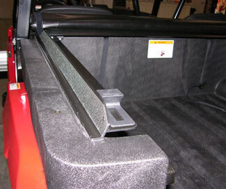 Close-up of cover's base rails on top of UTV's side-by-side box
