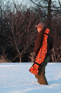 Use the adjustable shoulder sling while on the field