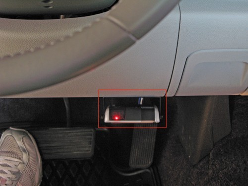 Red light indicating brake controller is connected to adapter