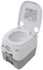 Dometic 970 series white and gray portable camping toilet.