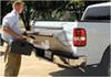 man opening truck bed tailgate. 