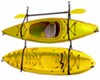 Two yellow kayaks being stored by Gear Up Hang 2 strap storage system.