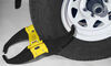 Rack'Em Lock'Em Magnum wheel lock in black and yellow on wheel. 