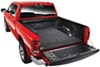 BedRug custom truck bed mat covering bed of red truck. 