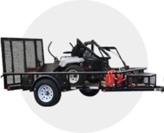 landscpae trailer carrying red riding lawnmower. 