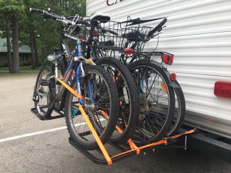 Bumper-mounted bike rack on travel trailer