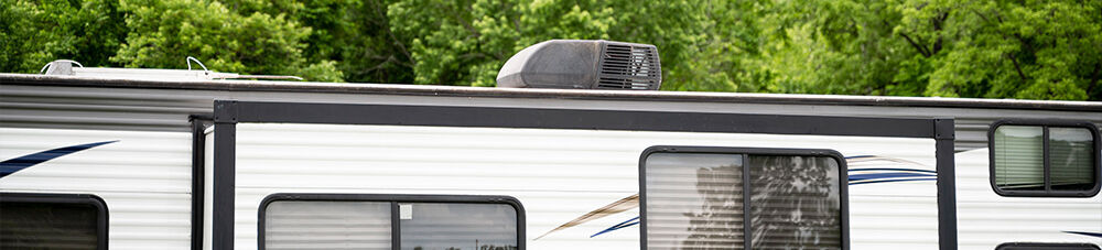 RV air conditioner mounted on roof of RV.