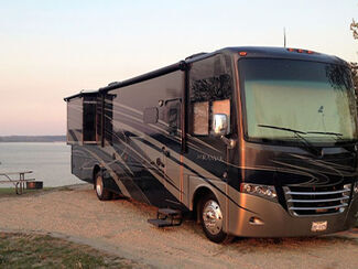 Power Sonic Lithium Ion battery for RVs. Black outer casing with handles. 