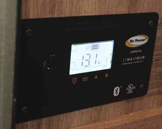 Go Power didgital solar controller on inside wall of RV. 