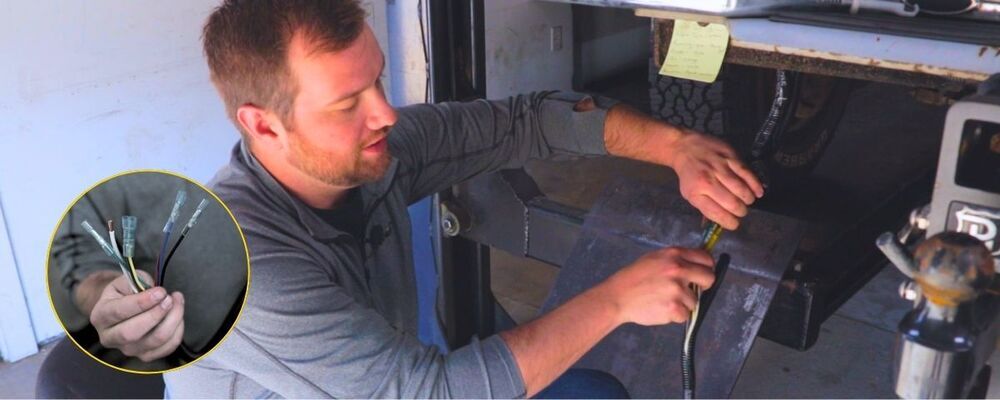 Man wiring 7-pole plug on trailer