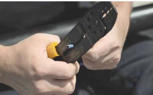 Wire stripper removing insulation on wires