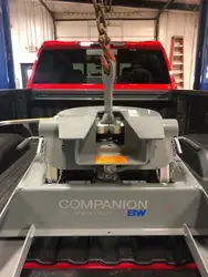 B and W Lifting Bracket on Companion 5th wheel in back of truck.