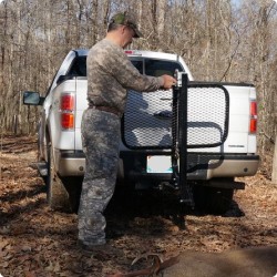 man putting rack on back of truck. 